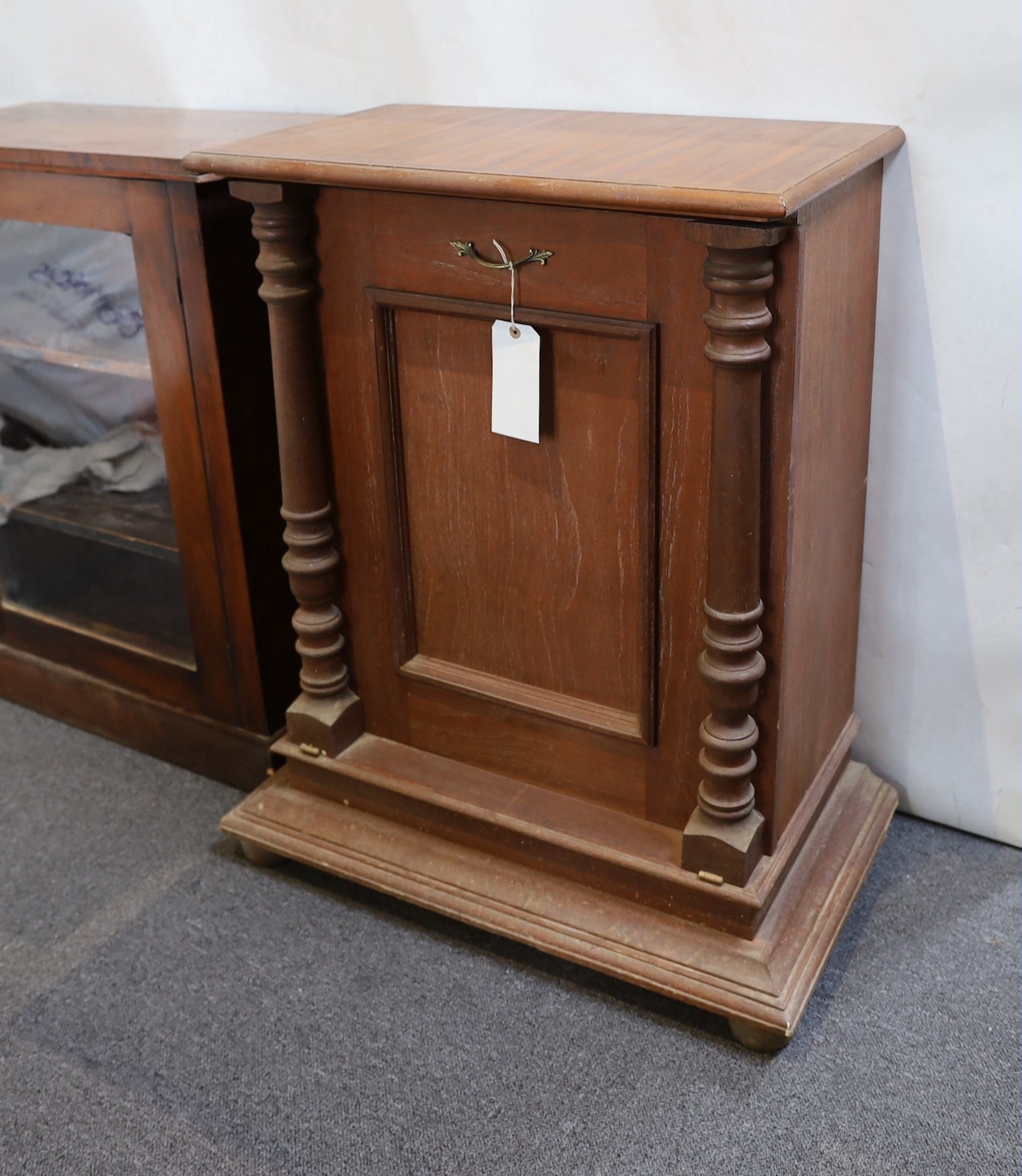 A mahogany Polyphon cabinet base housing approximately 20 19.5 inch discs and a Victorian walnut bookcase.